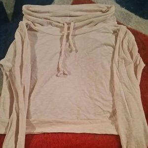 A light pink long sleeve crop top